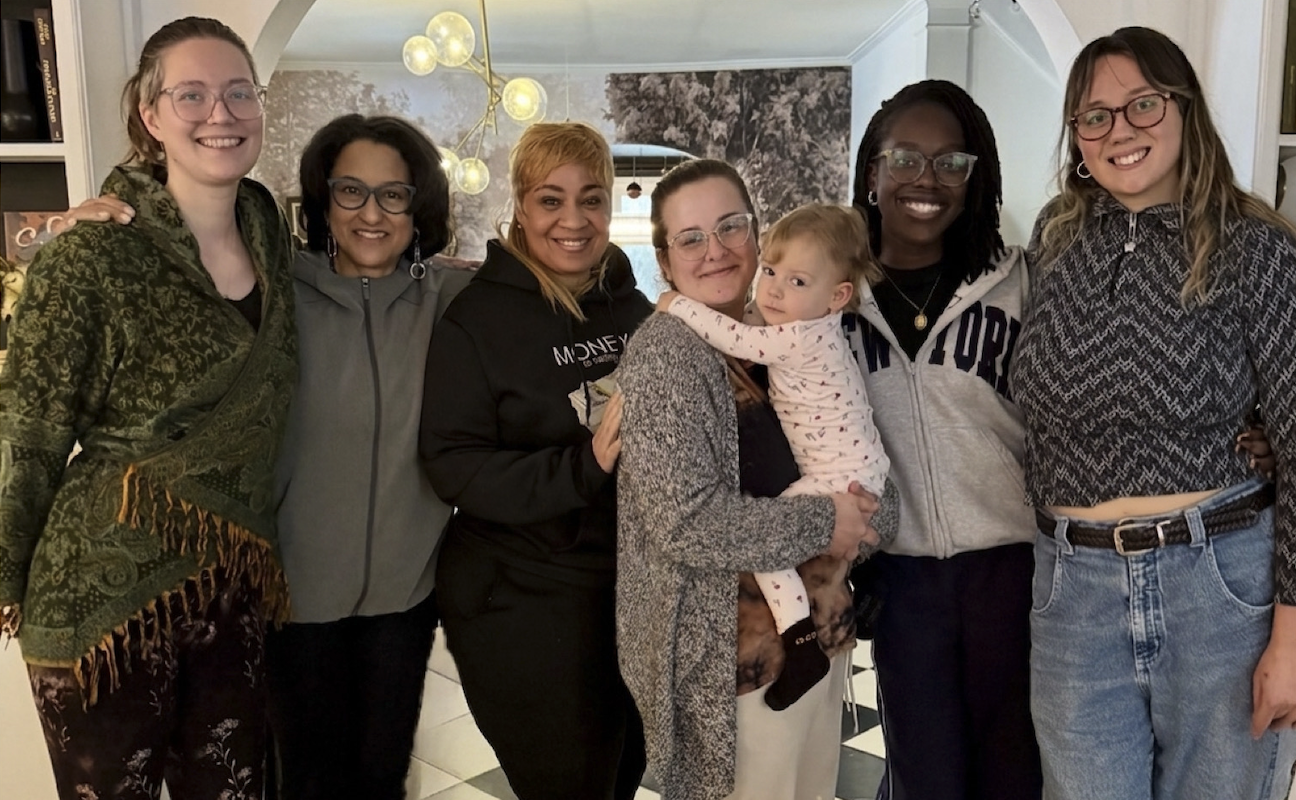 A group of doulas laughing together