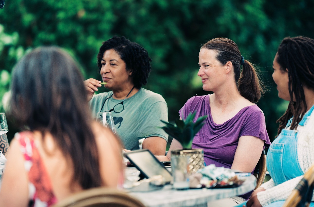 A DoulaBrella doula sharing a warm conversation with an expectant family