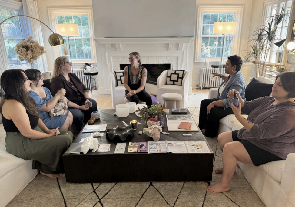 A doula and an expectant parent talking in a welcoming room