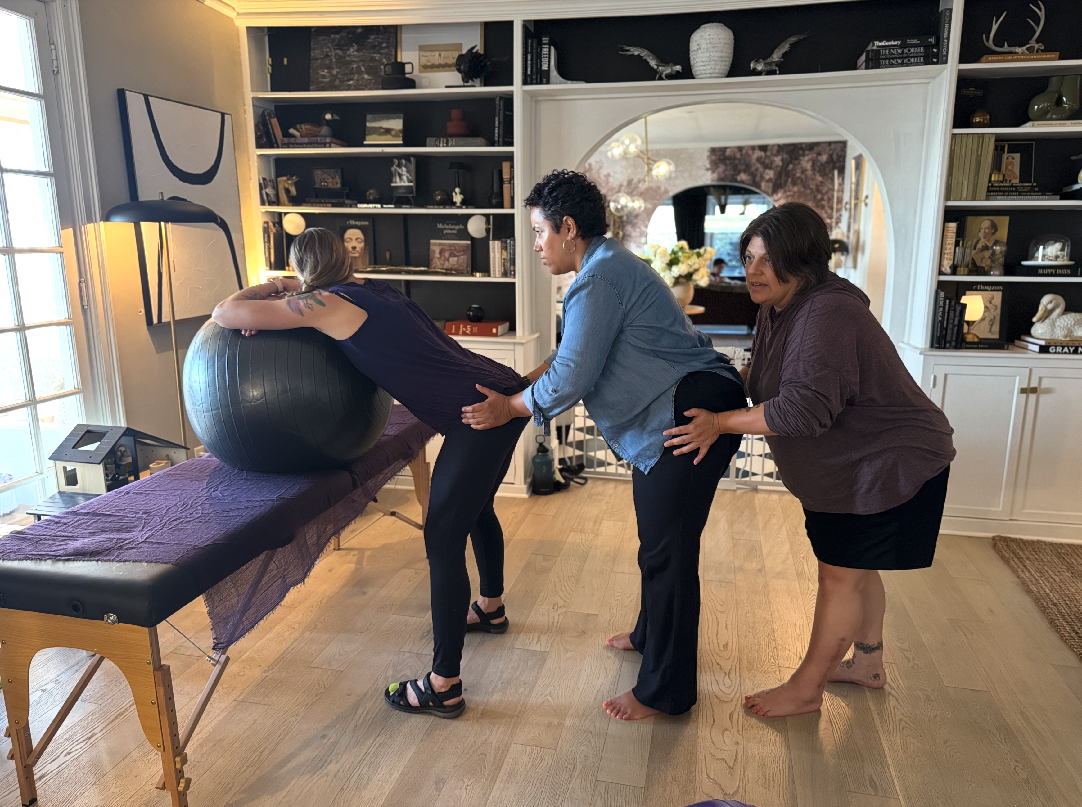 Training photo of three women supporting each other